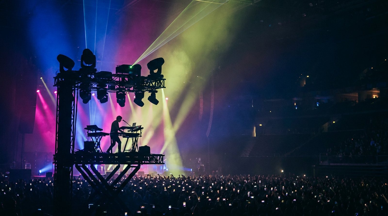 Keyboardist running their set with A1R on a grand concert stage
